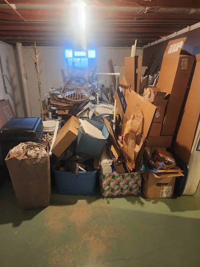 Roll-off dumpster container at job site for 2 Yard Dumpster Rental in Benton